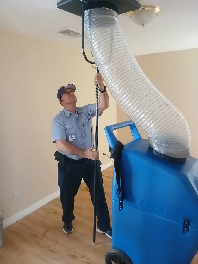 Furnace Tune-Up technician using HEPA equipment in Wheat Ridge